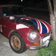 Illustration for article titled Olde English 800-Fueled Driver Obliterates Union Jack-Adorned MGB-GT, We Struggle To Find Meaning